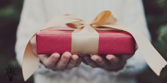 20151215130528-gift-giving-hands-present-charity